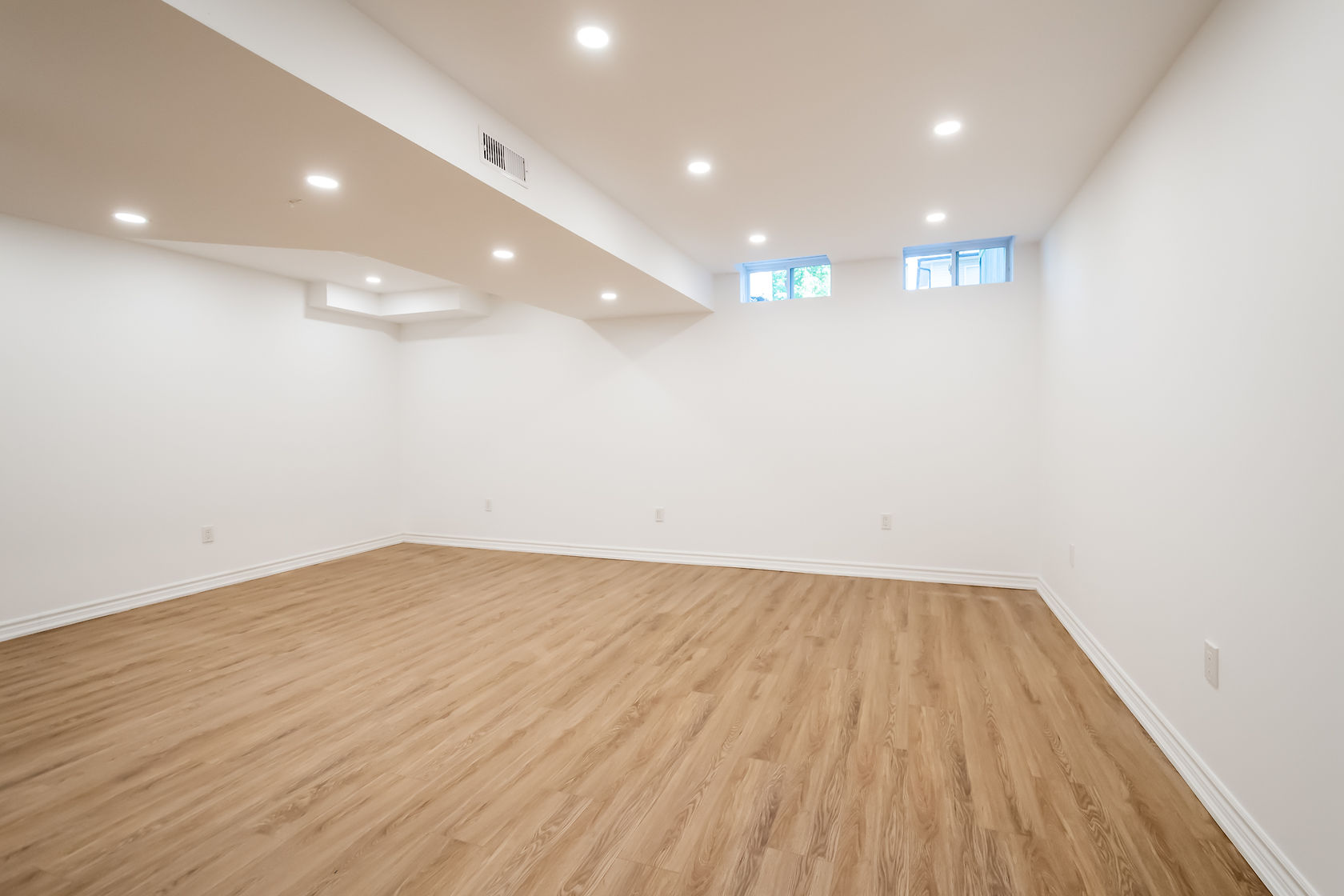 Bright finished basement with excellent recessed lighting and quality flooring — premium virtual tour shot — Stonehenge, Hamilton | MTC Renovations