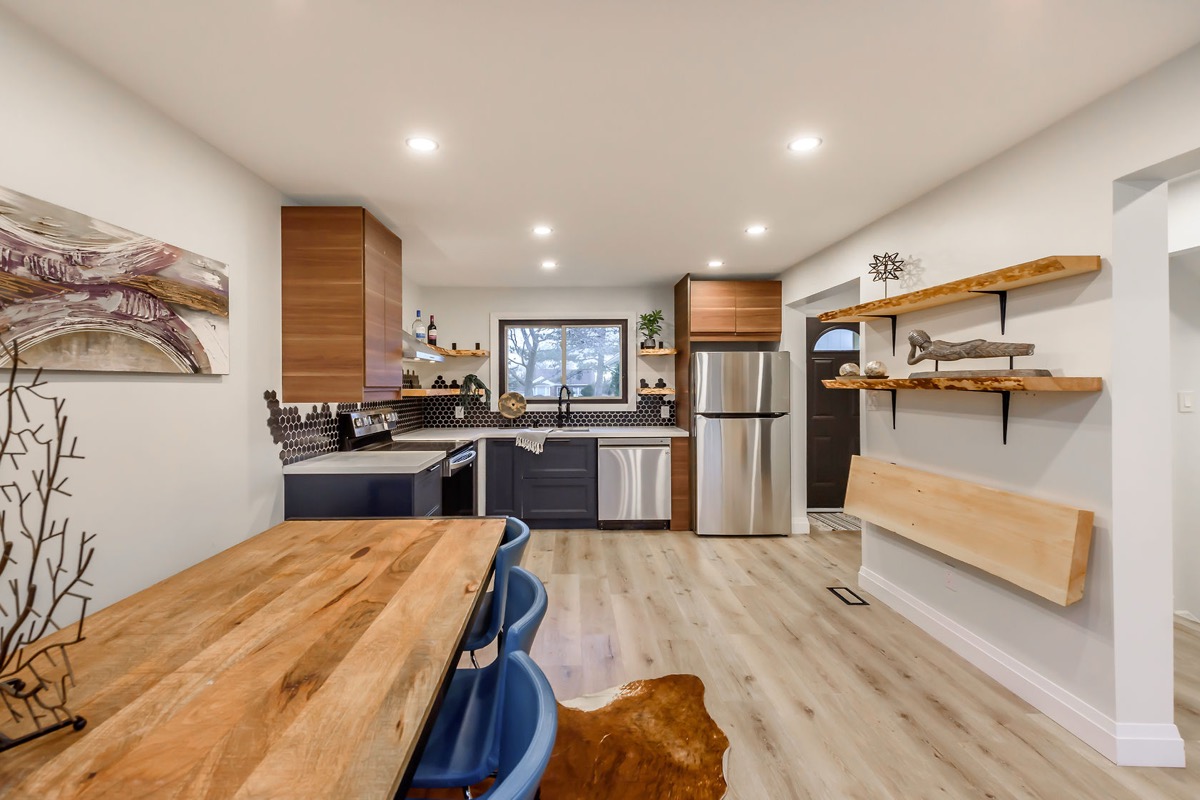 Kitchen renovation with wood grain contrast by MTC Renovations in Burlington